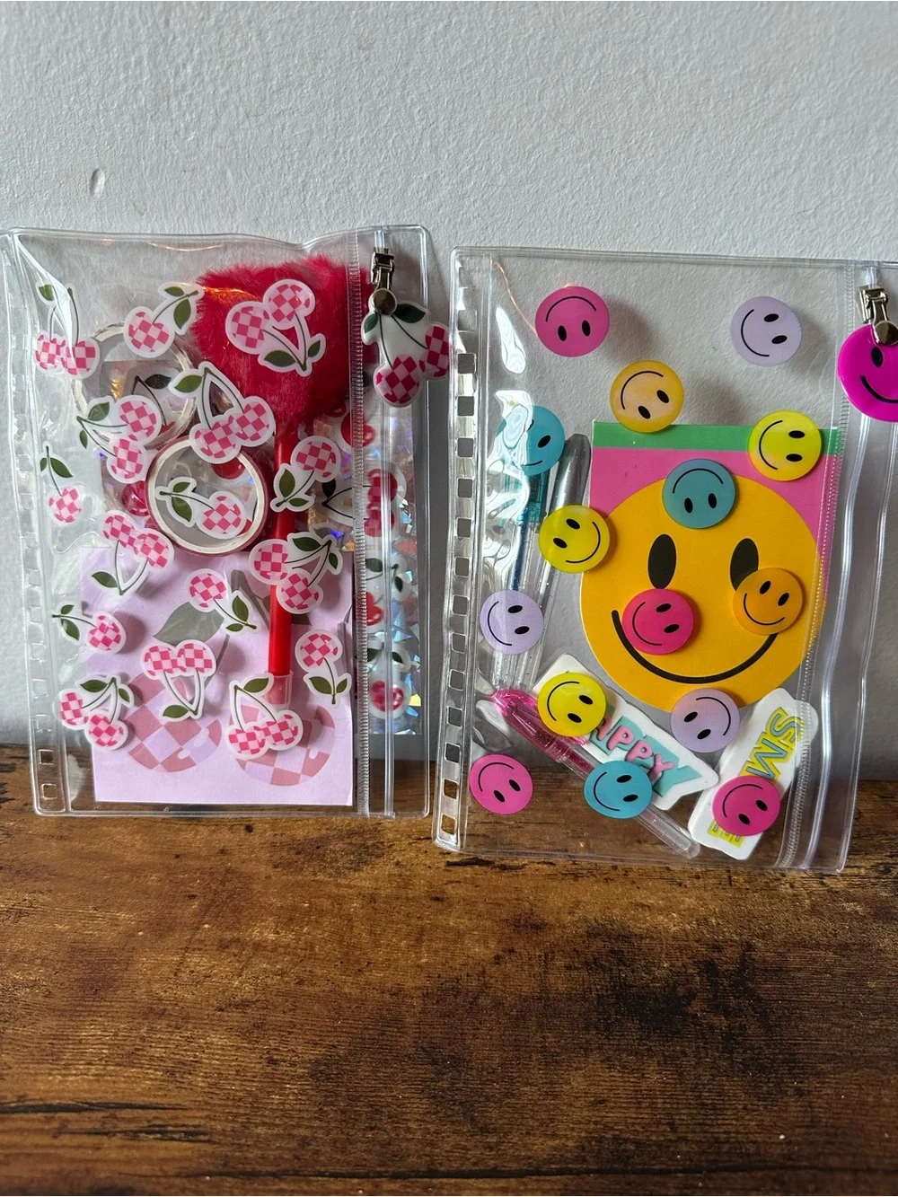 Two Zipper Pencil Pouches One Cherry & One Smiley Themed Pens Notepads Stickers